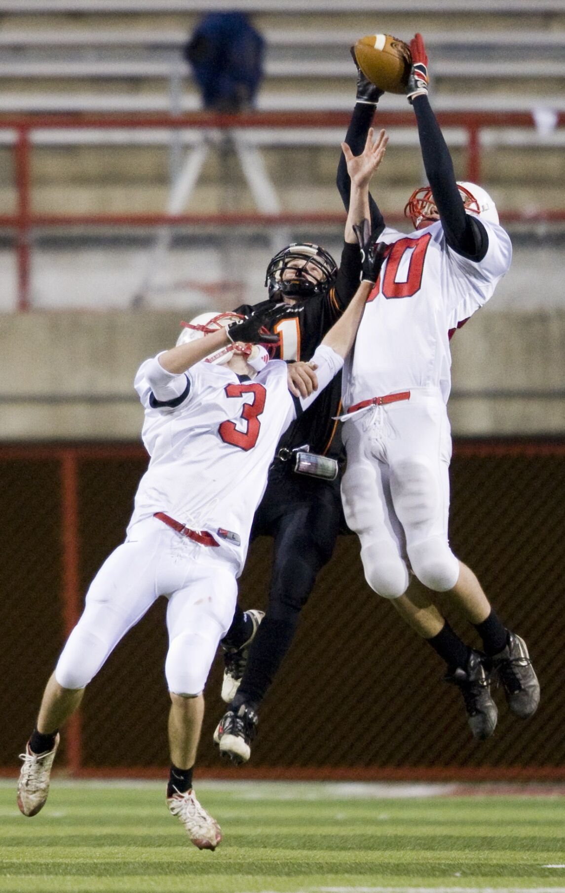Lincoln -- Aurora's Jacob Shaffer makes an interception with the assistance of Joshua Bart over Beatrice's Justin Coleman in the NSAA 2008 Class B State Football Championship at Memorial Stadium in Lincoln on Saturday, Nov. 22, 2008. (Alyssa Schukar/Oma...